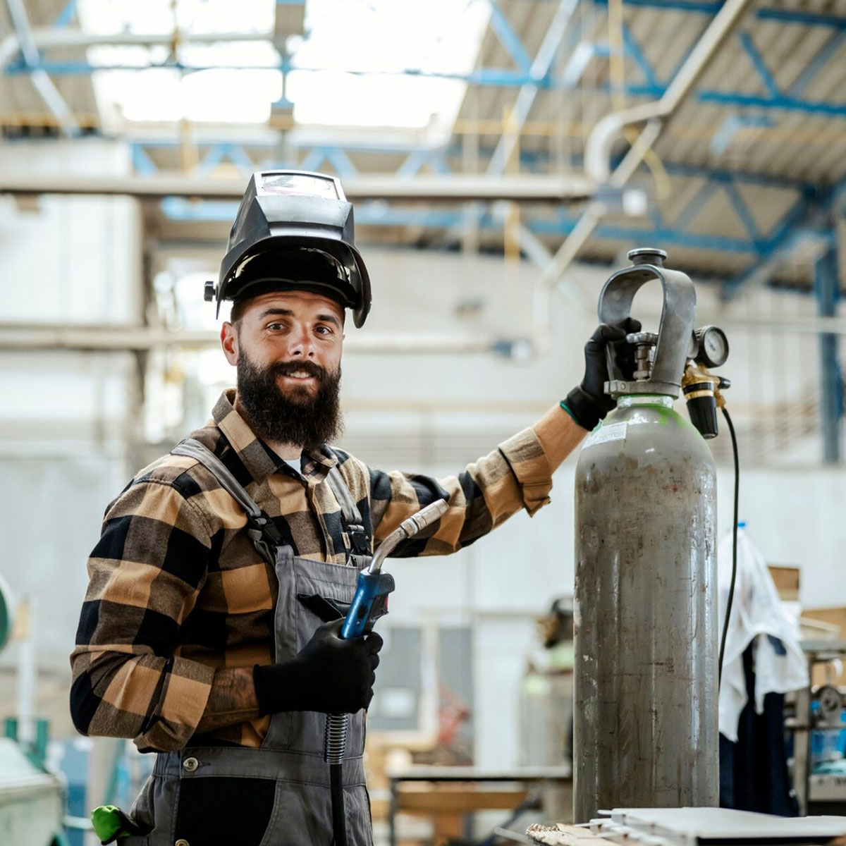 Welding student with equipment